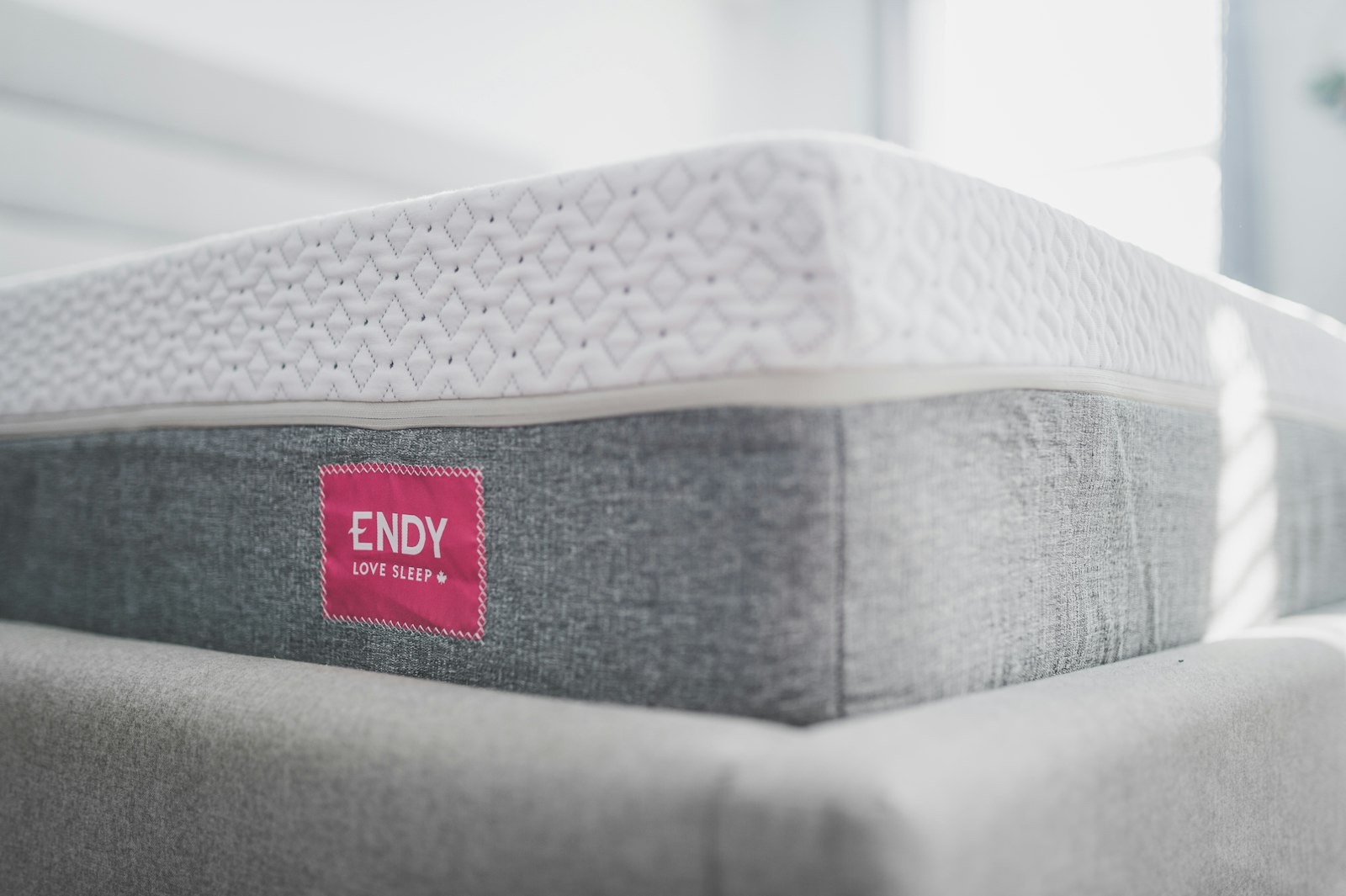 Close-up of a mattress with a price label, representing different price tiers